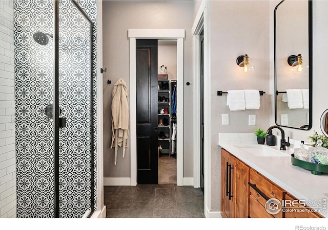 2025 Orchard Bloom Dr, Windsor, CO 80550 - full bath featuring a shower stall, vanity, baseboards, and tile patterned flooring