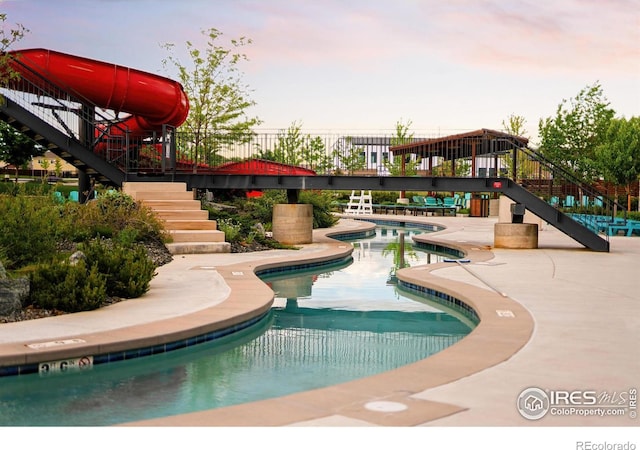 2025 Orchard Bloom Dr, Windsor, CO 80550 - community pool with stairway and a patio area