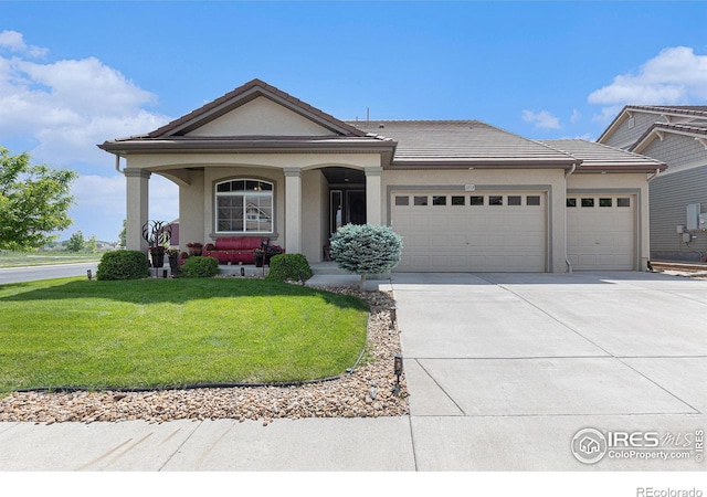 3713 Woodhaven Ln, Johnstown, CO 80534 - view of front facade featuring an attached garage, driveway, a front lawn, stucco siding, and a porch