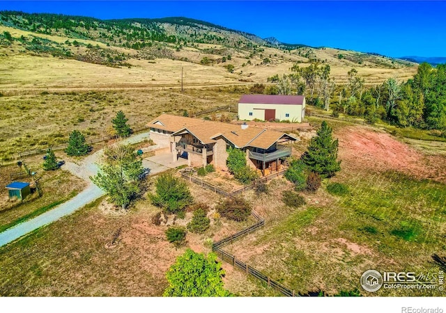 birds eye view of property with a rural view and a mountain view