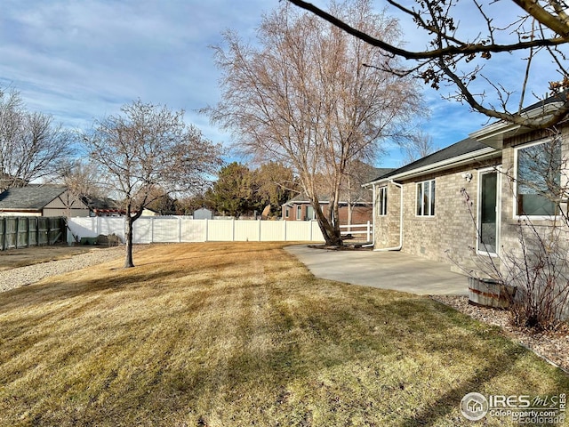 view of yard featuring a patio and a fenced backyard