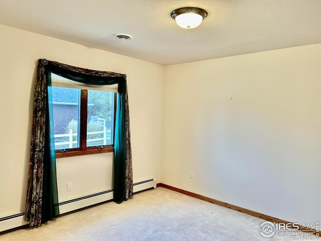 unfurnished room with a baseboard radiator, visible vents, light carpet, and baseboards