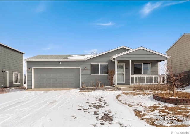 ranch-style home with a garage and covered porch