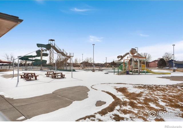 snow covered playground with playground community