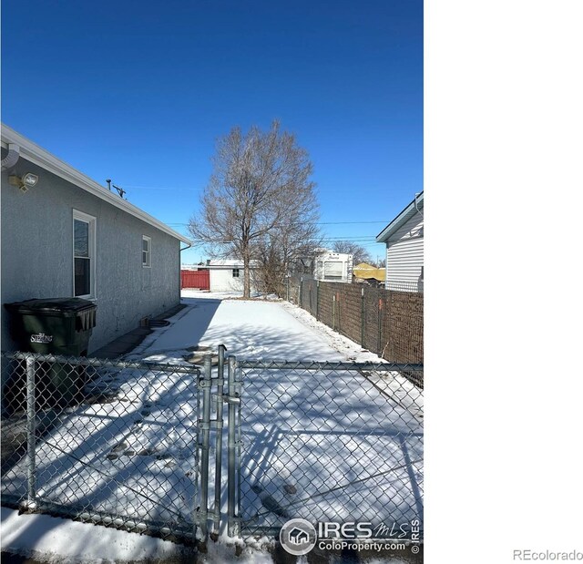 exterior space with fence and stucco siding