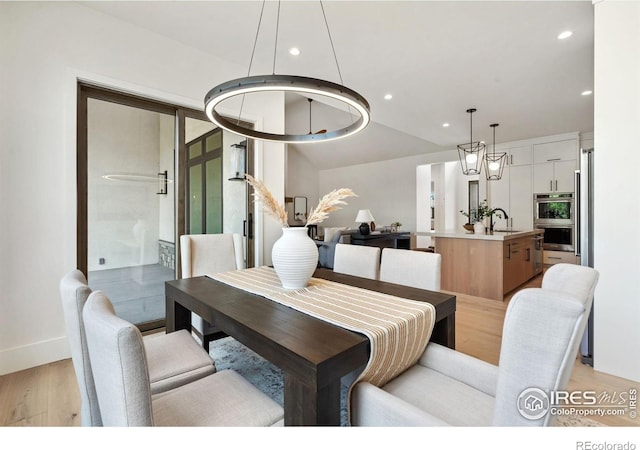 6398 Foundry Ct, Timnath, CO 80547 - dining room featuring light wood-type flooring, recessed lighting, and baseboards
