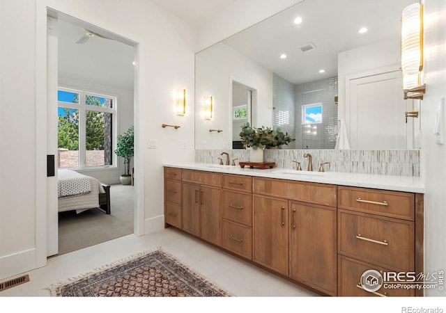 6398 Foundry Ct, Timnath, CO 80547 - ensuite bathroom featuring a shower stall, tasteful backsplash, double vanity, and recessed lighting