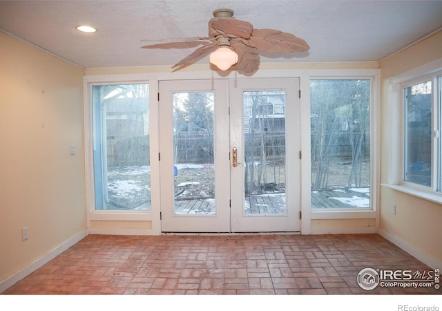 entryway featuring brick floor, baseboards, a ceiling fan, and recessed lighting