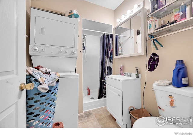 clothes washing area featuring laundry area, stacked washing maching and dryer, and a sink