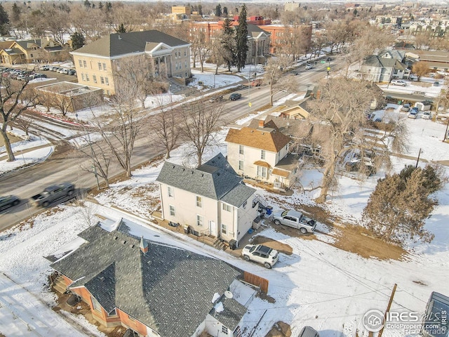 snowy aerial view with a residential view