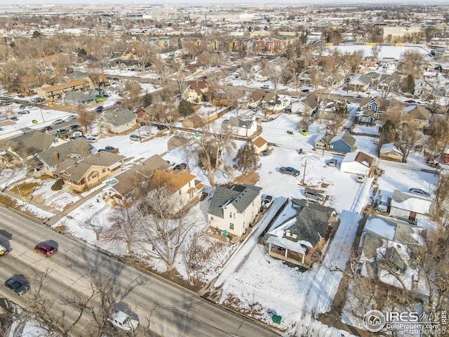 snowy aerial view featuring a residential view