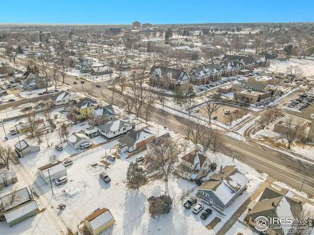 snowy aerial view featuring a residential view