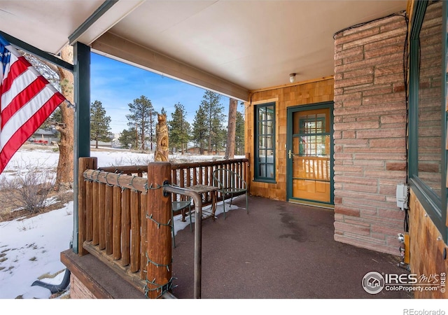 view of snow covered property entrance