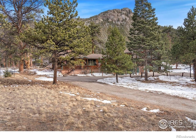 exterior space featuring a deck with mountain view