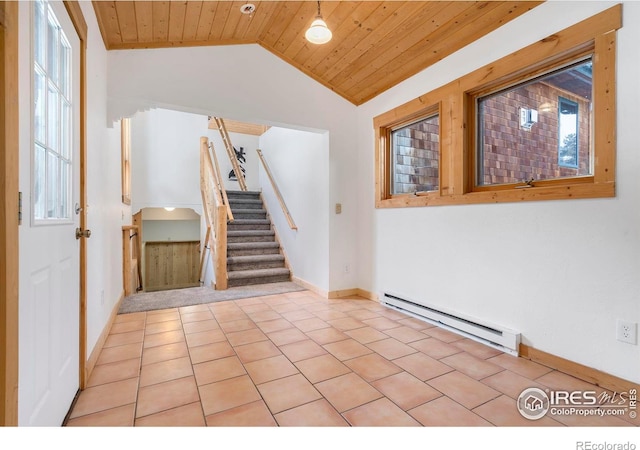 foyer with a wealth of natural light, lofted ceiling, baseboard heating, wood ceiling, and stairs