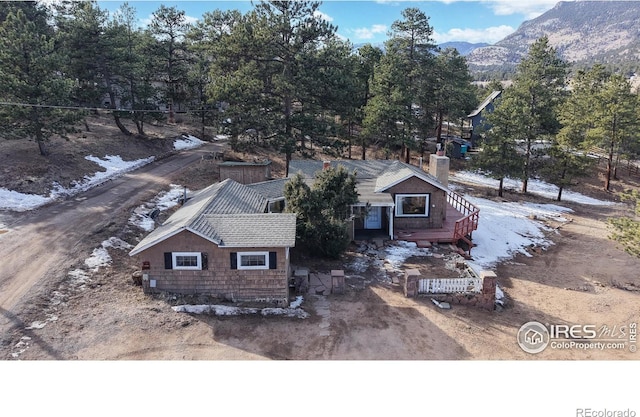 drone / aerial view featuring a mountain view