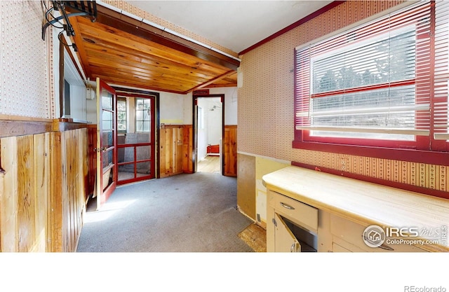 bathroom with lofted ceiling, wainscoting, wood ceiling, and wallpapered walls