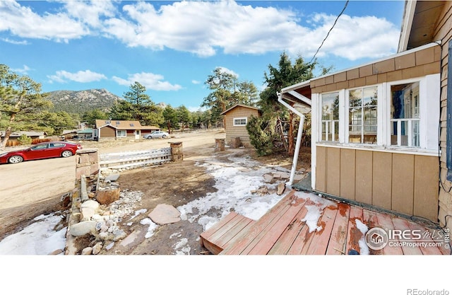 wooden terrace featuring a mountain view