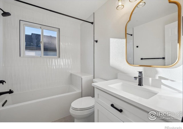 bathroom featuring tub / shower combination, vanity, and toilet