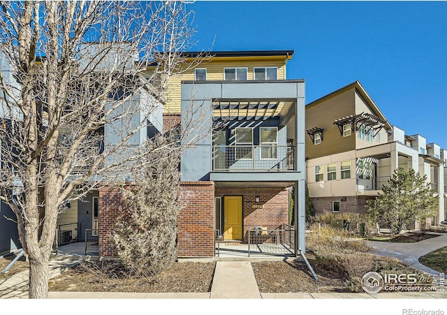 view of front of property featuring brick siding