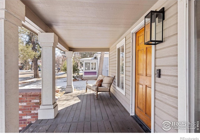 wooden terrace featuring a porch