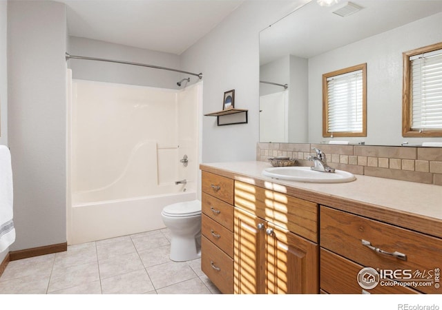 bathroom featuring visible vents, shower / bathing tub combination, toilet, vanity, and tile patterned floors