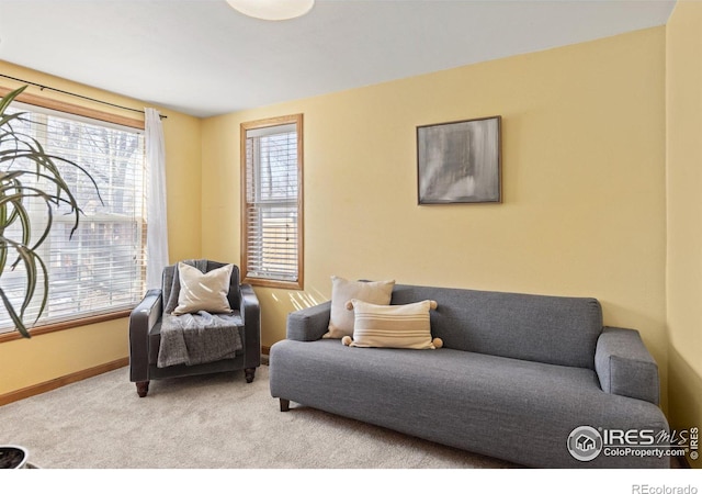 living room with light colored carpet and baseboards