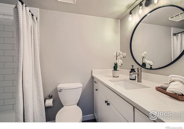 full bathroom with visible vents, vanity, and toilet