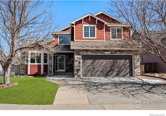 view of front facade with a garage, stone siding, concrete driveway, and a front yard