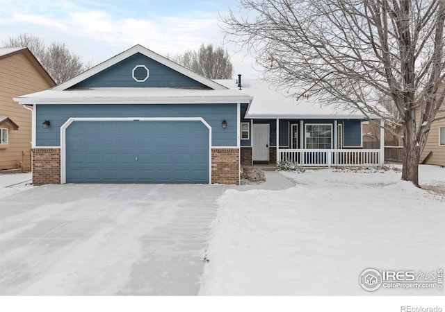 single story home featuring covered porch, brick siding, and an attached garage