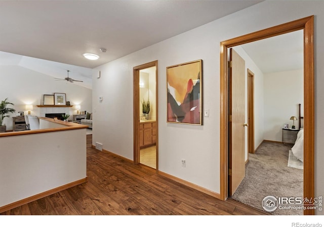 interior space with baseboards and wood finished floors