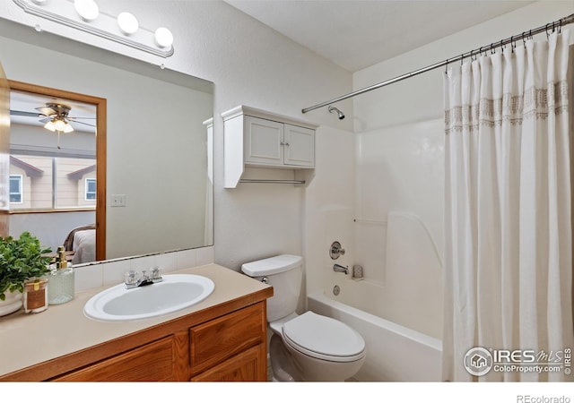 full bath with toilet, a ceiling fan, shower / tub combo with curtain, and vanity