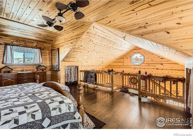 bedroom with lofted ceiling, wooden ceiling, wood finished floors, and wooden walls