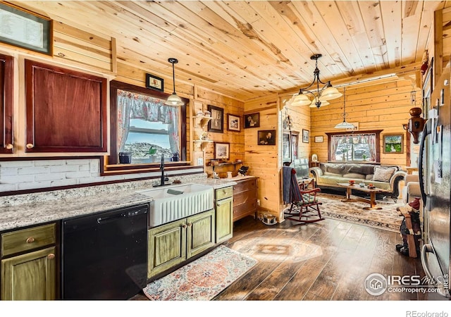 kitchen featuring a sink, light stone countertops, pendant lighting, and dishwasher