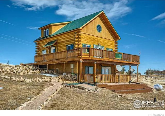 view of front of home featuring log exterior