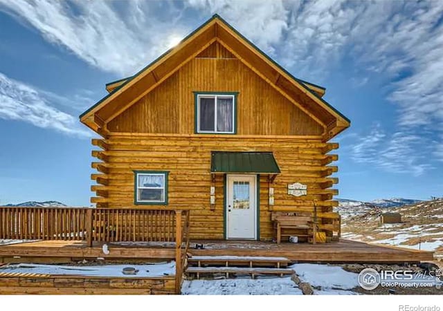 cabin with log exterior