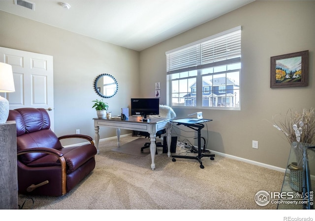 office with carpet flooring, visible vents, and baseboards