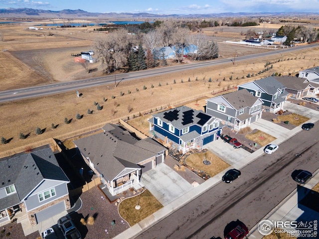 birds eye view of property featuring a residential view and a mountain view