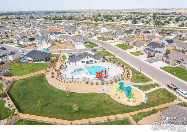 birds eye view of property with a residential view