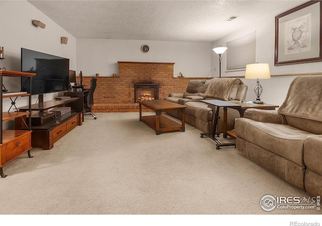 carpeted living room with a brick fireplace, visible vents, and a textured ceiling