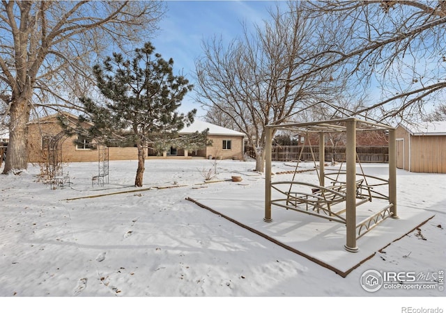 view of yard covered in snow