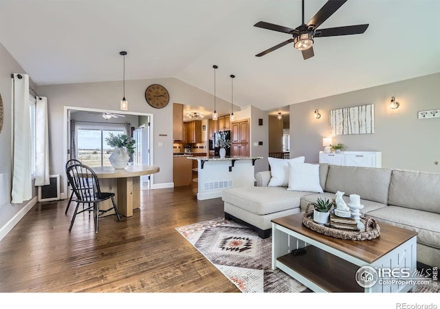 living room with a ceiling fan, lofted ceiling, dark wood-style flooring, and visible vents