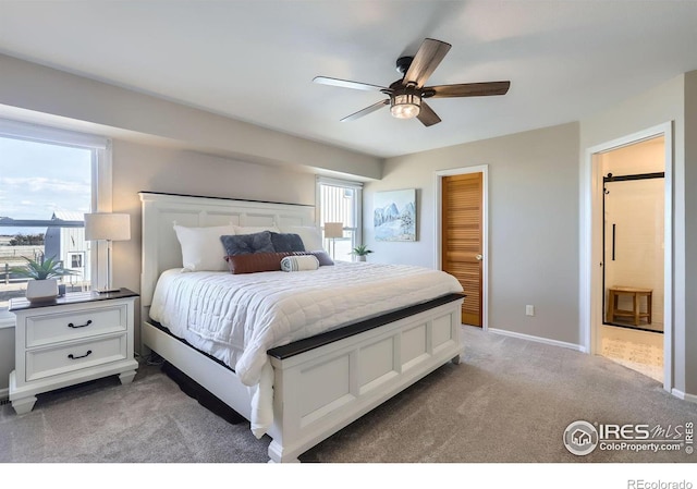 bedroom featuring light carpet, ceiling fan, multiple windows, and baseboards