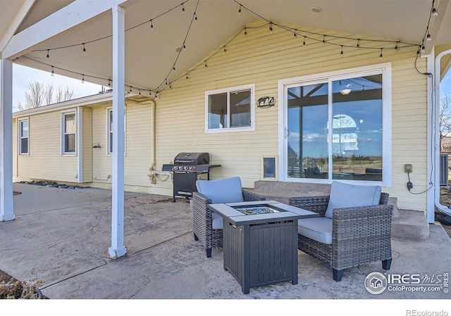 view of patio / terrace featuring a grill and a fire pit