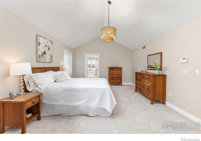 bedroom with lofted ceiling, light colored carpet, visible vents, connected bathroom, and baseboards