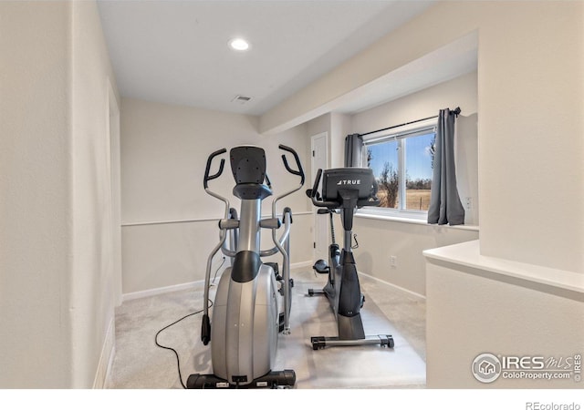 workout area featuring baseboards, recessed lighting, visible vents, and light colored carpet