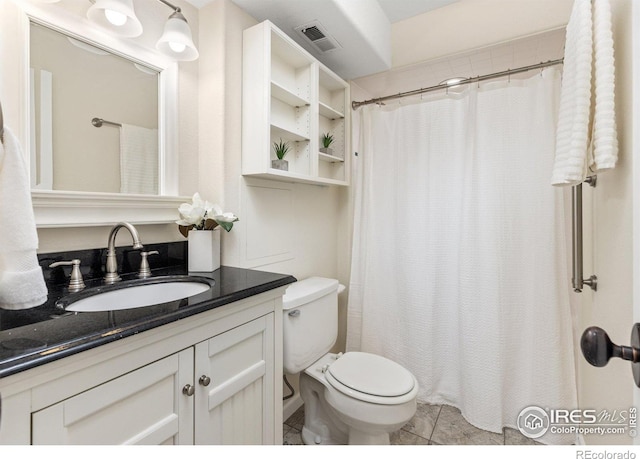 full bathroom featuring toilet, tile patterned flooring, visible vents, and vanity