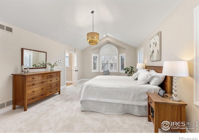 bedroom with light colored carpet, visible vents, vaulted ceiling, and baseboards