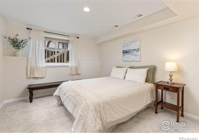 bedroom featuring recessed lighting, visible vents, light carpet, and baseboards