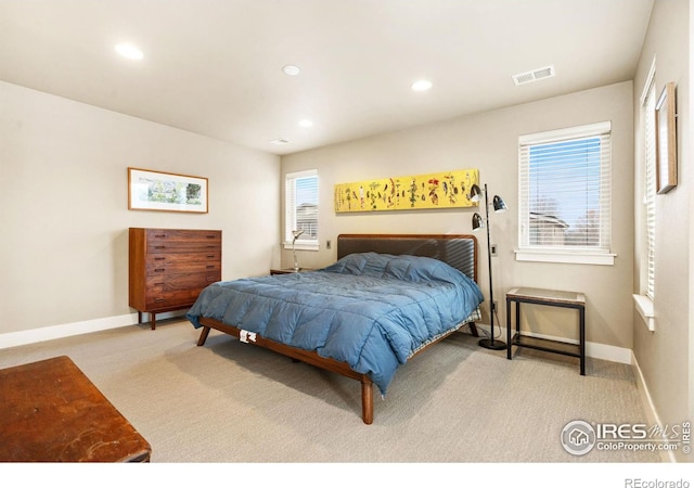 bedroom featuring recessed lighting, baseboards, visible vents, and light colored carpet